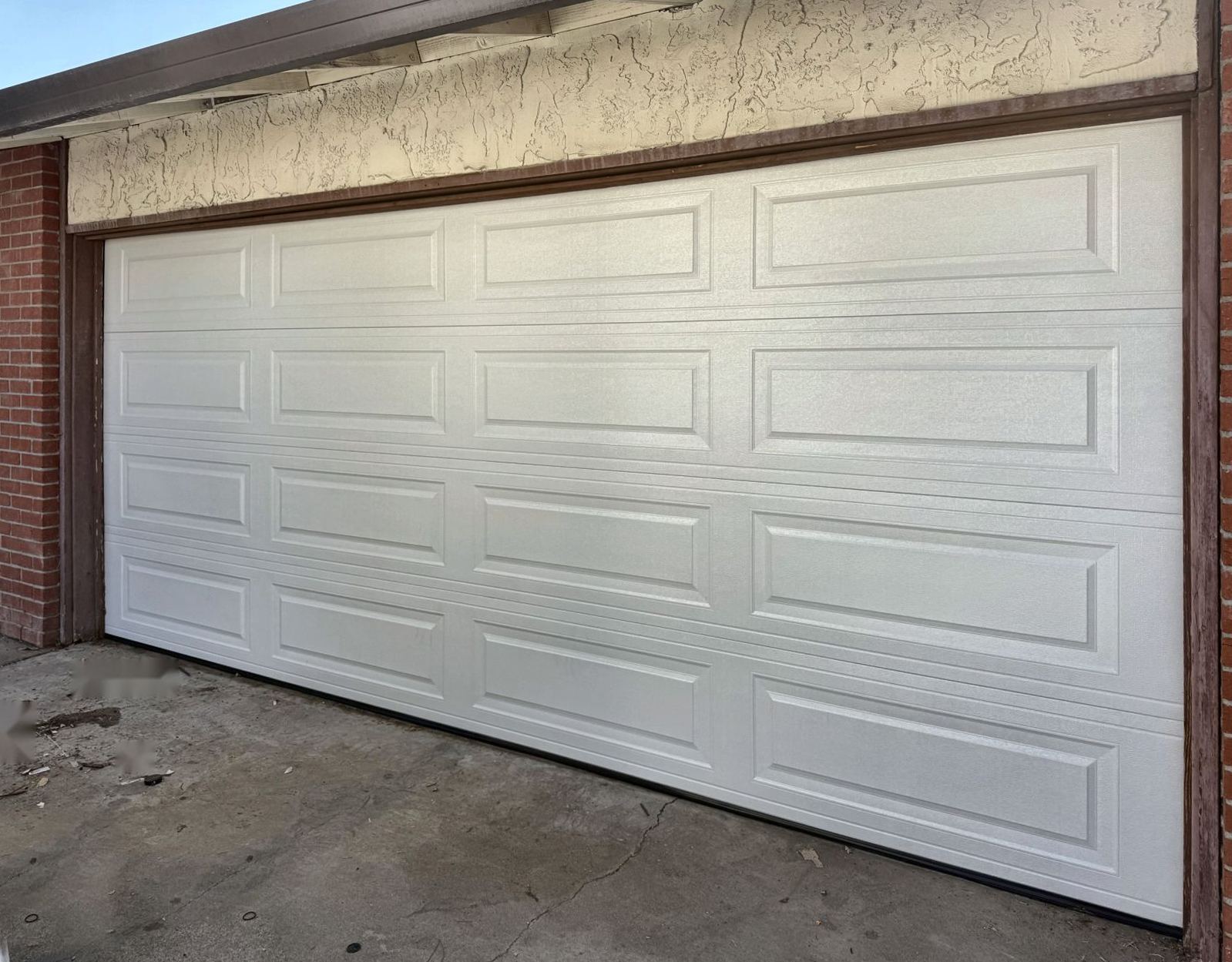 After: Old worn door replaced with a new steel door