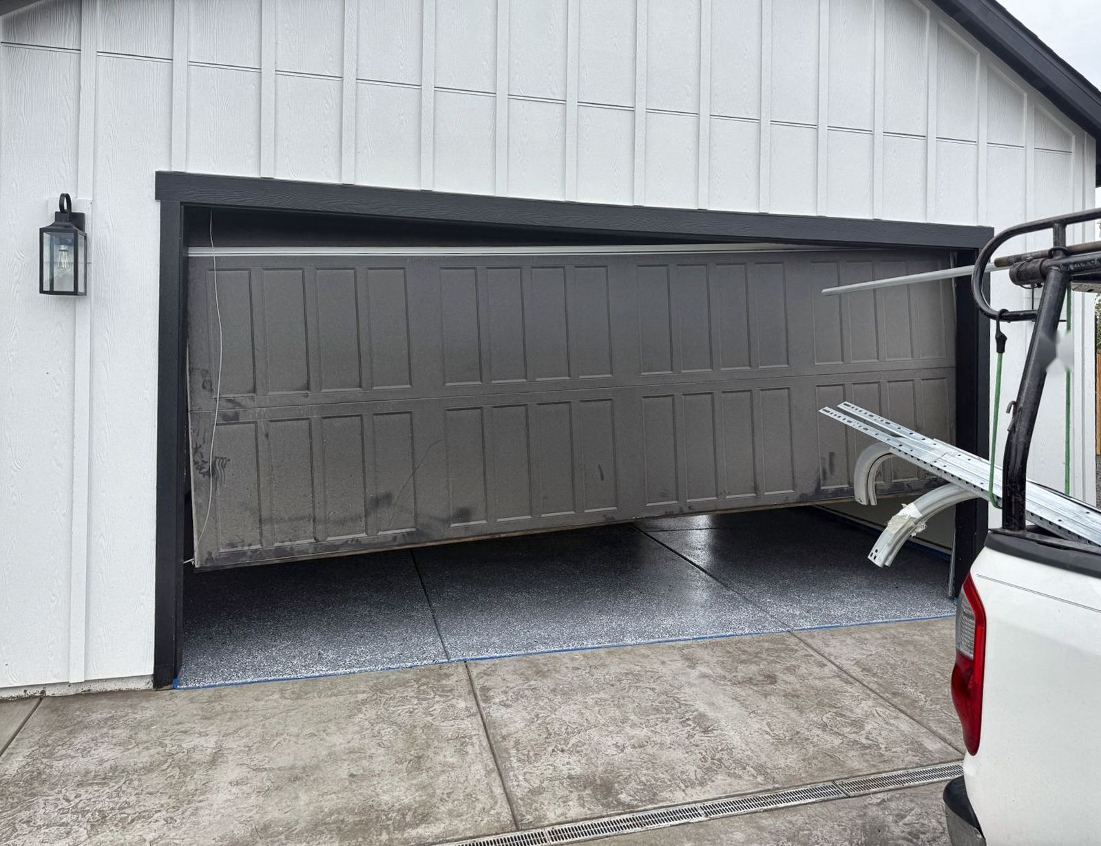 Before: Crooked door repaired and back in service