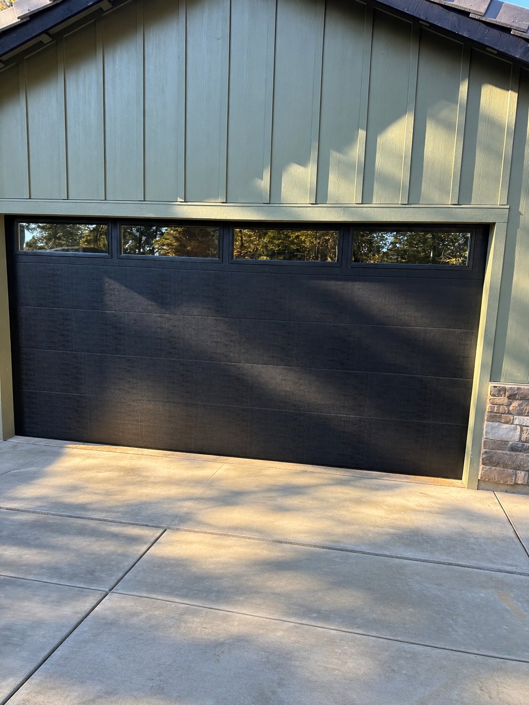 Black flush garage door with top windows