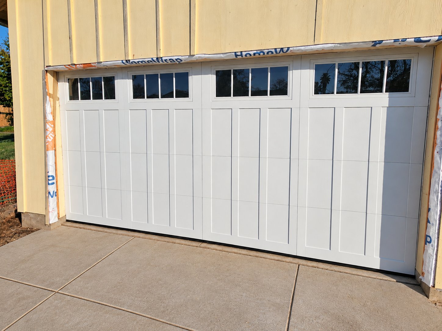 White 4-layer garage door with grid windows