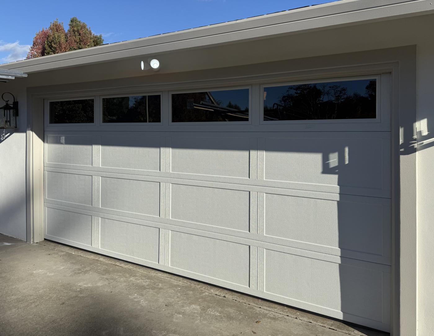 White 4-layer double garage door with top windows