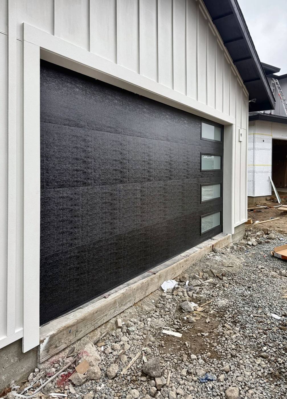 Black flush garage door with side windows