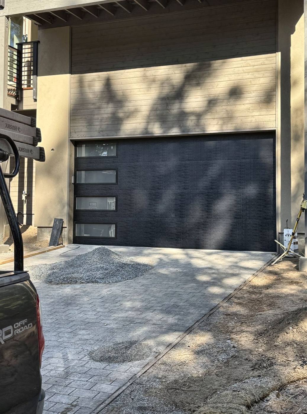 Black flush garage door with side windows