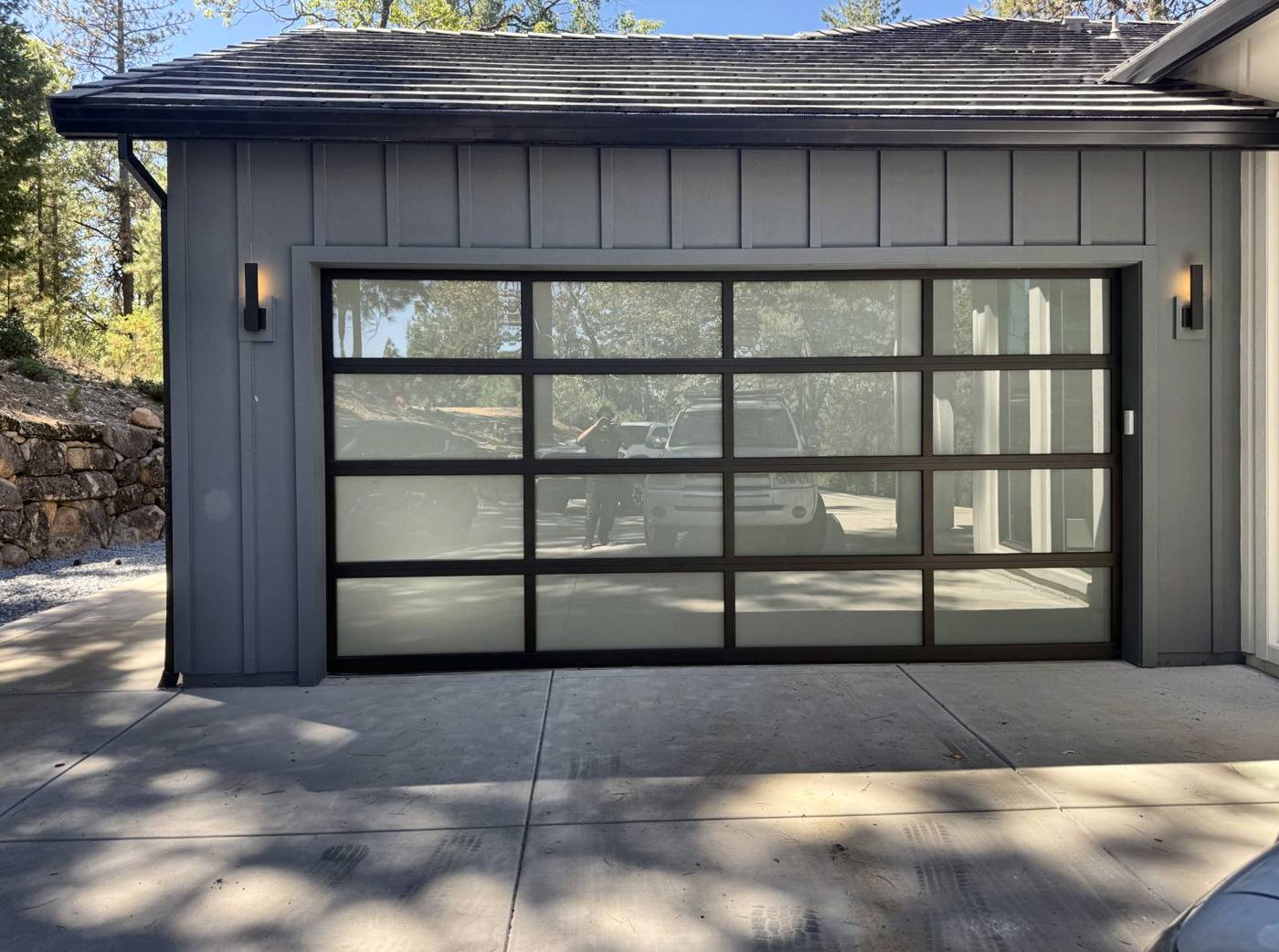 Full-view frosted glass door on a gray garage