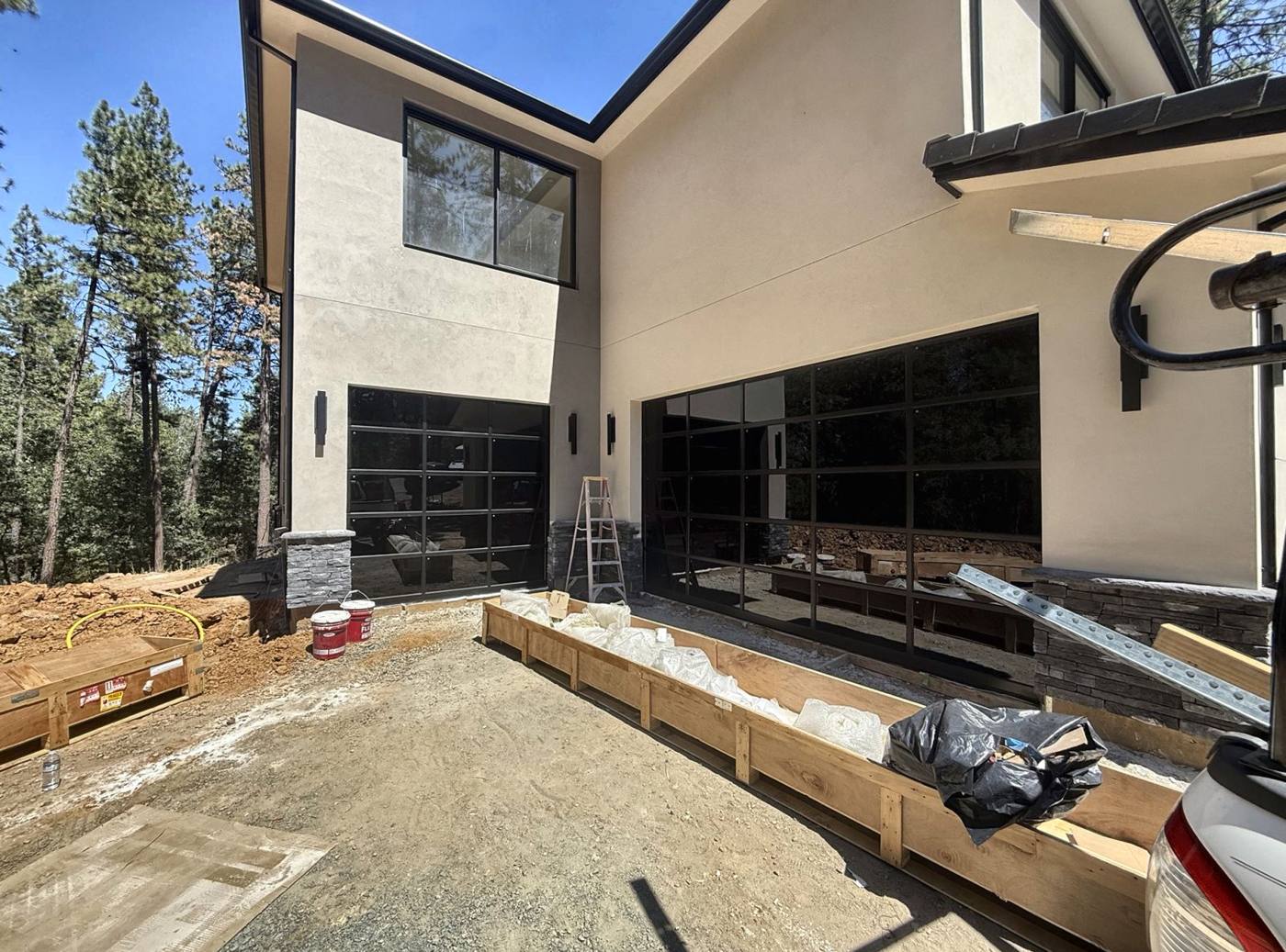 Full-view glass doors on a new mountain home