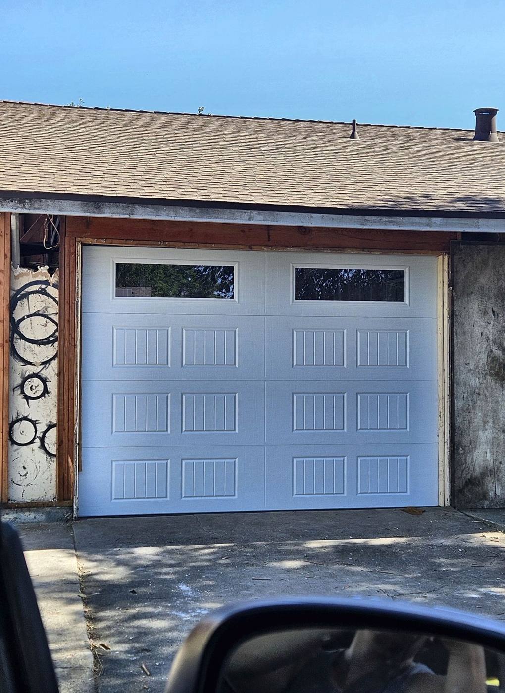 White single garage door with top windows