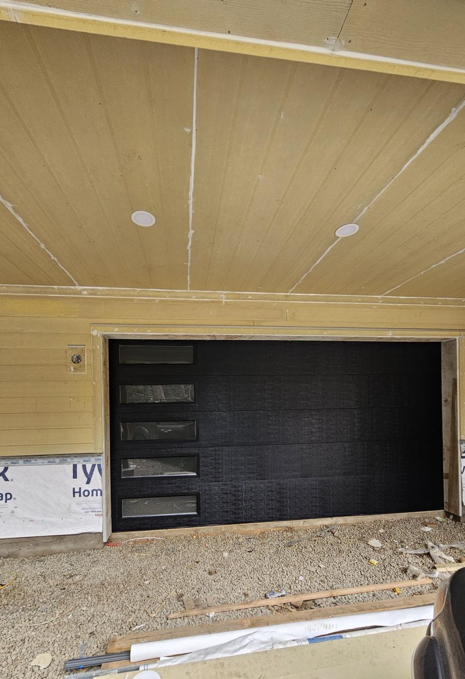 Black flush garage door with side windows