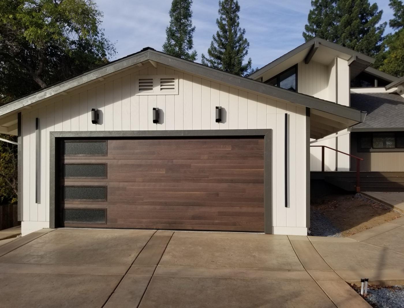 Woodgrain flush garage door with side windows