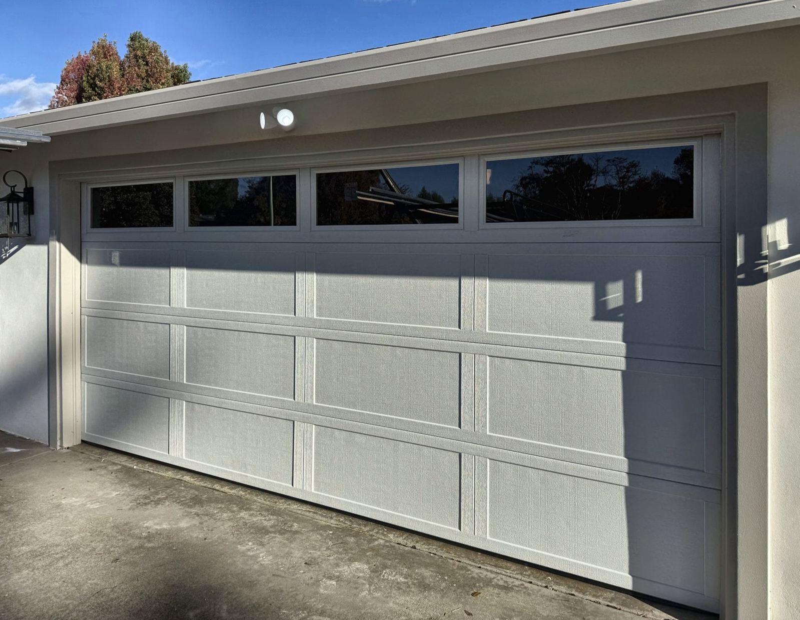 White garage door with a row of top windows