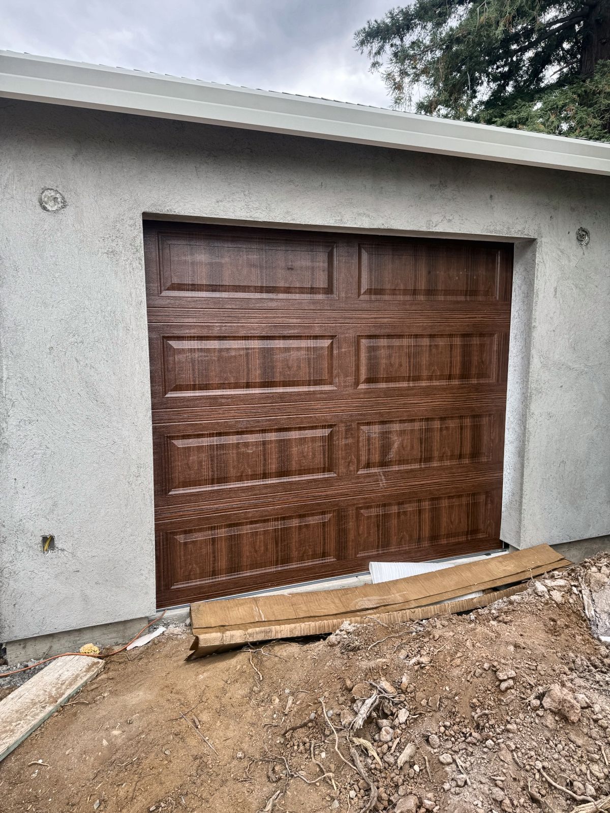 Woodgrain raised-panel steel garage door